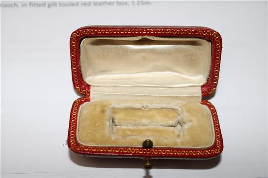 An 18ct gold mounted carved coral brooch, in fitted gilt tooled red leather box, 1.25in.